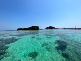 Fototapeta premium Seafront at Daylight on Pulau Tidung, one of the Thousand Islands close to Jakarta, Indonesia