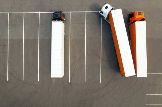 drone photo from above from a height to the parking lot of heavy trucks. The concept of logistics and transportation of goods.