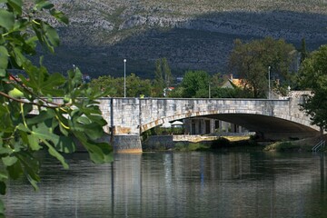 Fototapeta na wymiar Bridge over river, the mountains