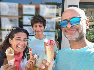 Family enjoying an ice cream on holiday