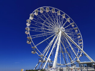 Views of a large white Ferris wheel