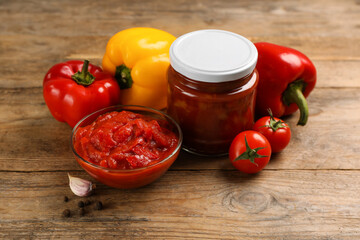Delicious lecho and fresh ingredients on wooden table