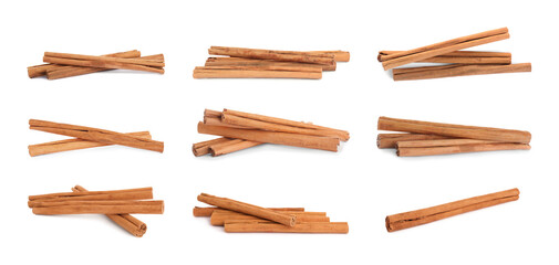 Set with aromatic dry cinnamon sticks on white background