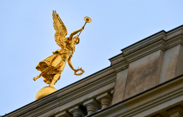Golden statue decoration at the city streets. Dresden, Germany