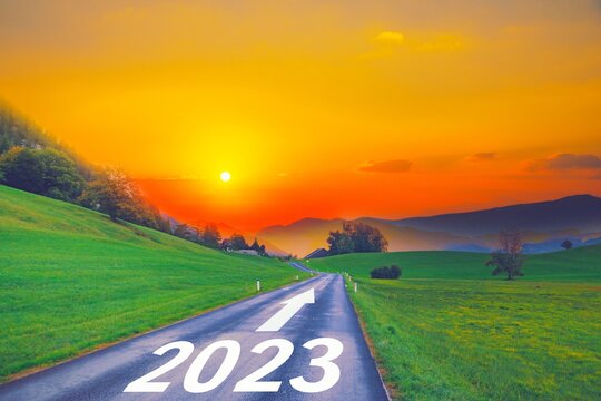 Open empty road path end and new year 2023. Upcoming 2023 goals and leaving behind 2022 year. passing time future, life plan change, work start run line, sunset hope growth begin, go forward concept.