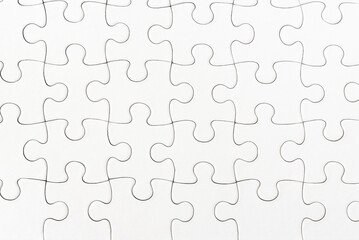 close-up view of plain white jigsaw puzzle background