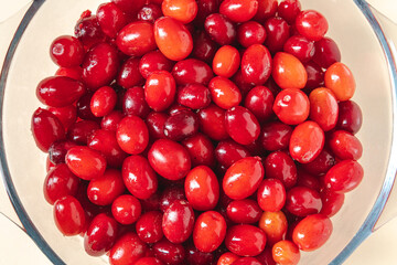 Fresh cranberries in a glass bowl. Healthy eating concept