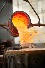 The perfect moment in bronze casting in an italian artistic foundry, vertical