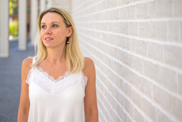 Attractive blond woman watching off to the side