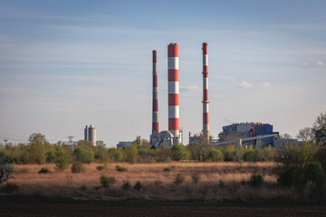 Fototapeta na wymiar Chimneys of Siekierki Power Station in Warsaw, Poland