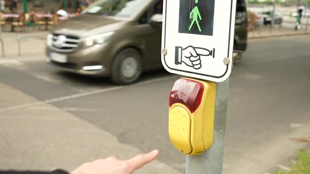 Pressing the button to make the pedestrian lights switch