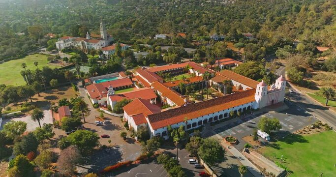 Rich luxurious mansions with beautiful buildings and nature around. Sunny picture of amazing Santa Barbara from aerial view.