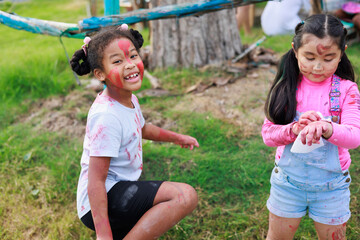 Diverse happiness kid group playing in playground at summer camp learning