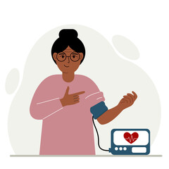 Woman checks blood pressure. healthcare concept. Blood pressure measurement, digital tonometer. Health monitoring.