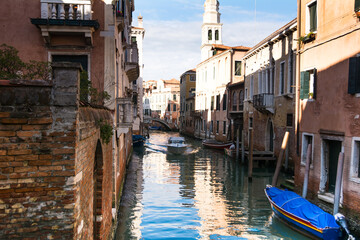 View of a narrow canal and ancient building at Venice, Veneto, Italy.