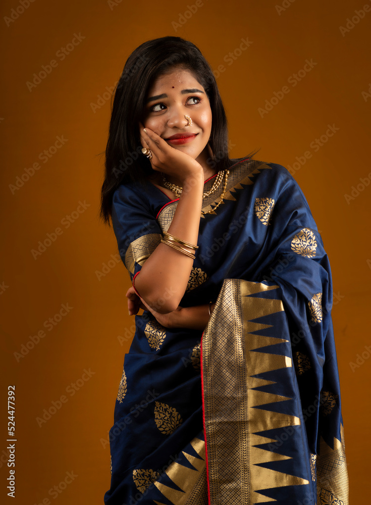 Poster portrait of a young girl or woman thinking on a brown background