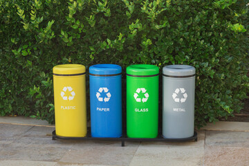 Colorful trash bins for waste segregation. (plastic, paper, metal, glass). Separate waste...