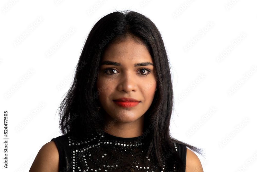 Wall mural Portrait of a young girl wearing black dress posing on a white background