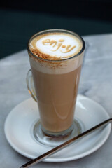 Close-up of latte coffee in a transparent cup with 