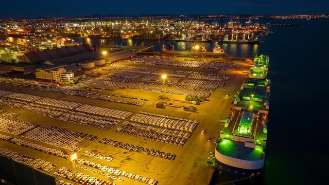 Many new cars running cargo ship, Ro-Ro Ship for import export shipping cars by Vessel Freight forwarding service ship, Logistics transportation dealer shipping Cars Cars Export Terminal. time lapse