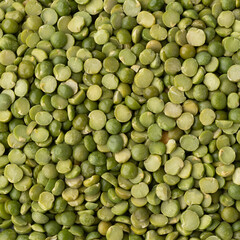 Closeup, top view of raw dried green peas. Food backdrop