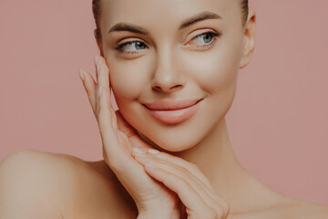 Beautiful young woman with clean fresh skin look away. Girl beauty face care. Facial treatment....