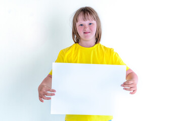 A teenage girl with blond hair in a yellow T-shirt holds a sheet of A3 paper and smiles. mock up...