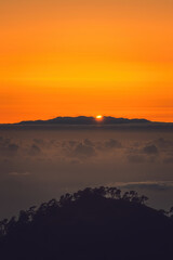 Sunset above La Palma island above the clouds