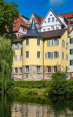 Fototapeta na wymiar The Hölderlin Tower on the historic old town bank of the Neckar River in Tübingen. Baden-Württemberg, Germany, Europe