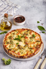 Quiche open tart pie with salmon fish and broccoli. Savory taste.