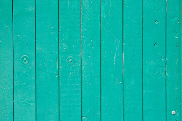 Wood background texture. Wooden surface, old boards, blue-green paint, blank retro template for advertising lettering, rough material, grungy textured background closeup.