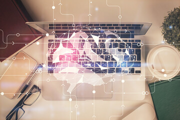 Multi exposure of brain sketch hologram over topview work table background with computer. Concept of big data.