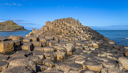 Mountain of hexagonal basalt columns of Giant's Causeway UNESCO World Heritage Site, is an area of about 40,000 interlocking , the result of an ancient volcanic fissure eruption