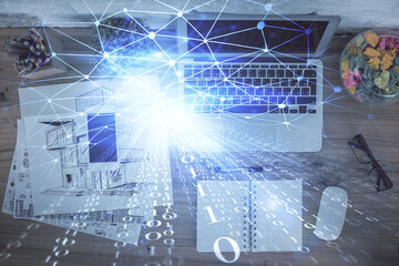 Double exposure of data theme drawing hologram over topview work table background with computer. Concept of technology.