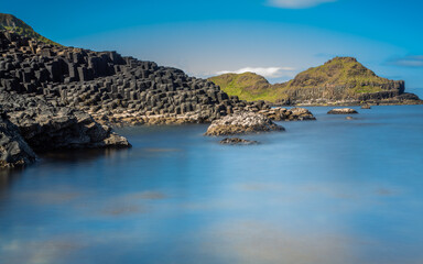 Obraz premium Beautiful Exposure of Giant's Causeway UNESCO World Heritage Site, is an area of about 40,000 interlocking hexagonal basalt columns, the result of an ancient volcanic fissure eruption. It is located i