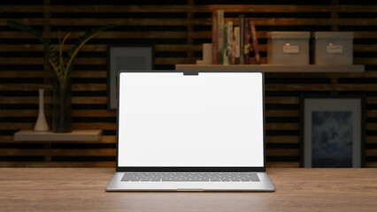 Mock-up of a modern laptop with a white screen for design demonstration on the wood table in a cozy interior atmosphere.