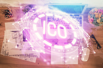 Blockchain theme hologram drawings over computer on the desktop background. Top view. Double...