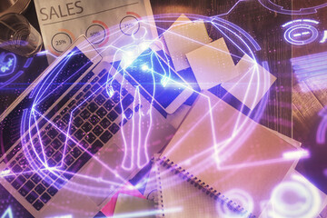 Education hologram drawings over computer on the desktop background. Top view. Multi exposure.