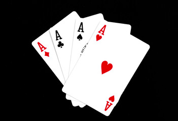 Royal playing cards on a black background.