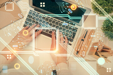 Double exposure of woman hands working on computer and data theme hologram drawing. Top View. Technology concept.