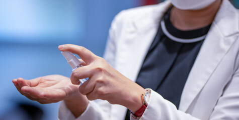 woman hands using sanitizer gel