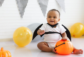 girl, Halloween toddler in Dracula costume, sitting, white background