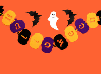 Halloween photo of black bats, ghost on blank orange background. Halloween decoration