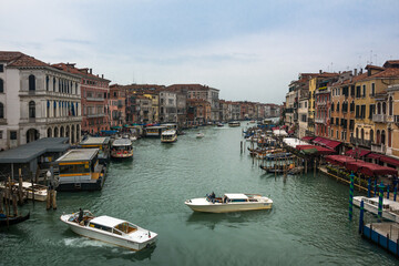Fototapeta na wymiar A beautiful view of the Grand Canal and boats and ancient buildings at Venice, Veneto, Italy.