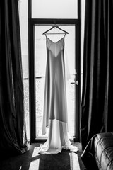 wedding dress in the hotel on the background of the window