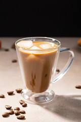 Glass of a iced coffee with cream milk copy space