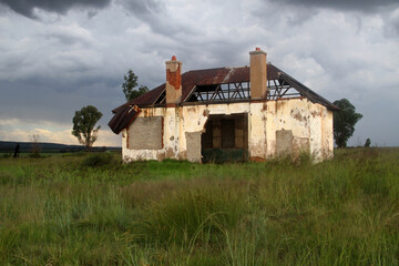 Fototapeta premium Photo of abandoned old houses and buildings in South Africa, red stone, mud and stone walls