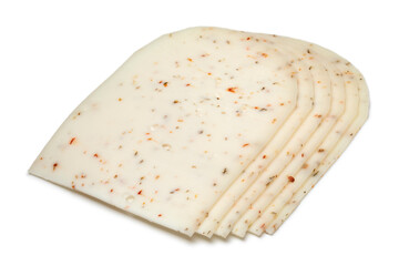 Slices of Dutch goat cheese with Italian herbs close up isolated on white background