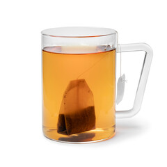 Glass cup with tea and a tea bag isolated on white background
