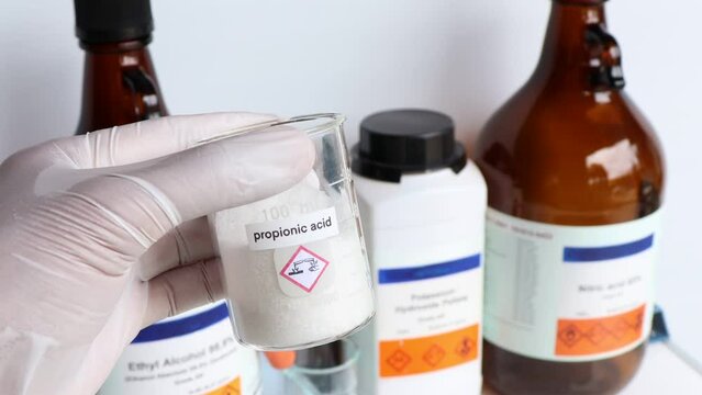 propionic acid in glass, chemical in the laboratory and industry